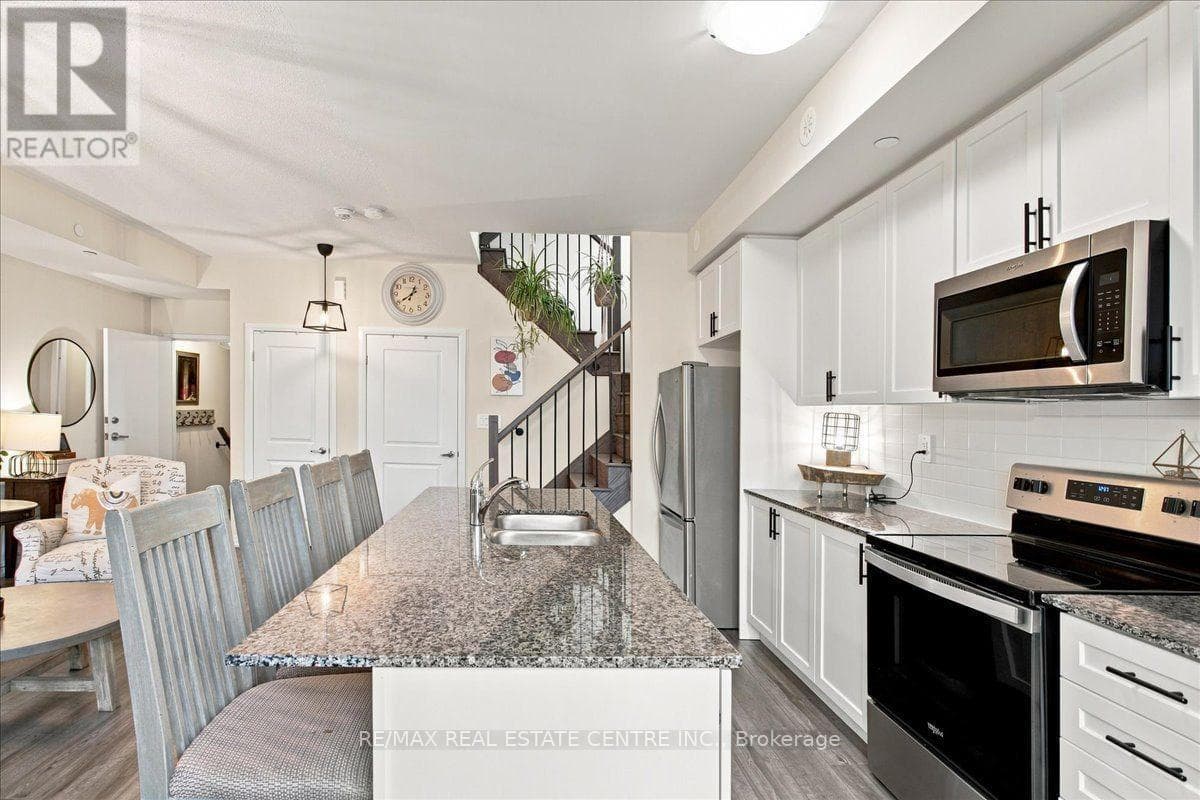 Photo of 103 - 1597 ROSE WAY